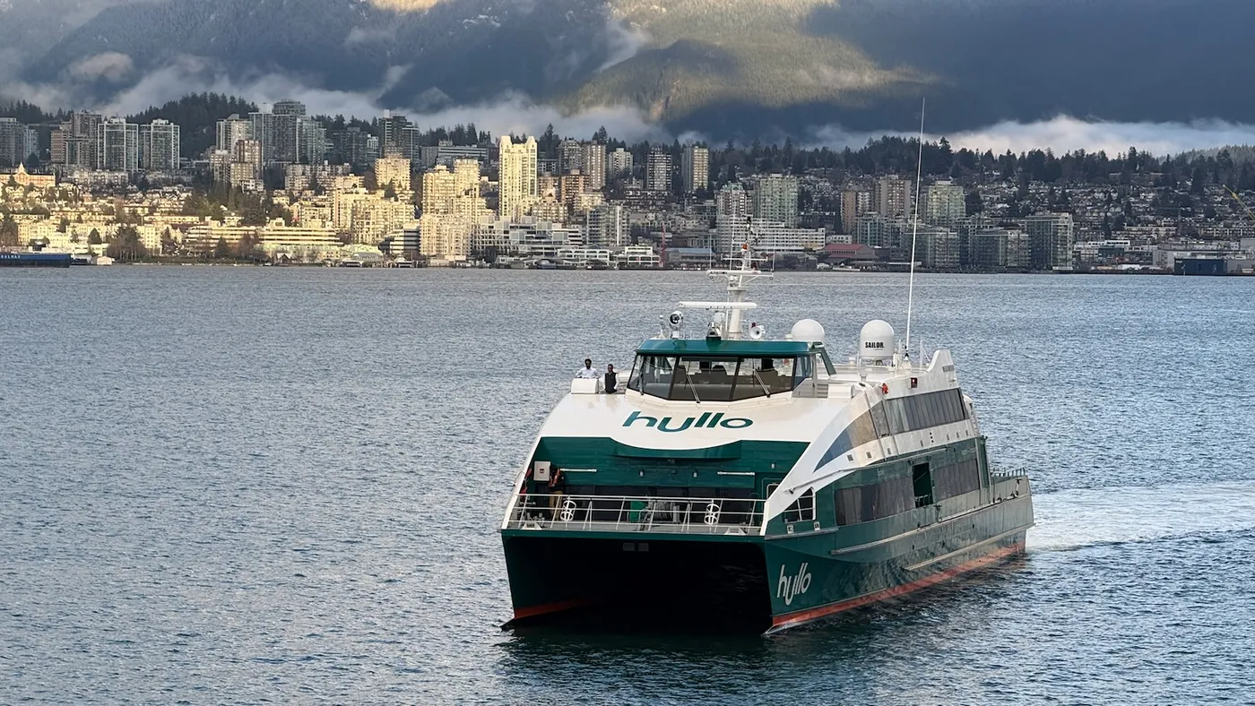 Hullo Ferry catamaran approaching Canada Place in downtown Vancouver